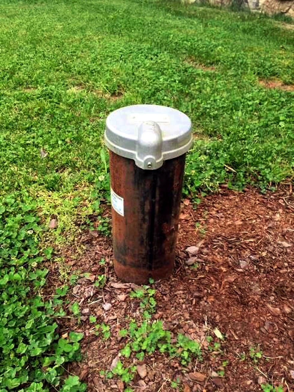This is a wellhead in a yard. Normally, our caps are silver or red. When you check, our name and number are on most caps. We also place service stickers on the tank and filter units for customer reference.