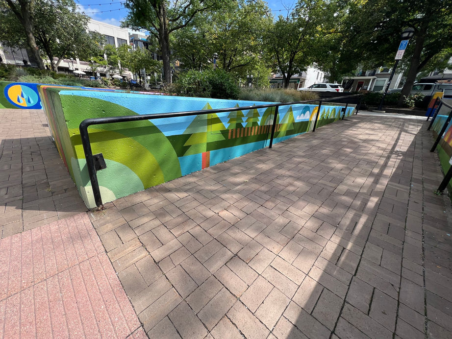 A series of 25 murals painted in a colorful, geometric style in Liberty Plaza, Ann Arbor, MI in 2025. 