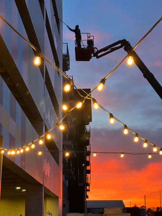 Large geometric mural with net-zero living shapes and symbols