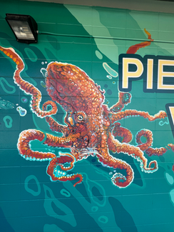 This section of mural features a Pacific Octopus, a Sea otter, and the words "Pierce County Votes"