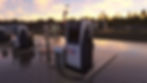 Modern fuel dispenser at an airfield during sunset