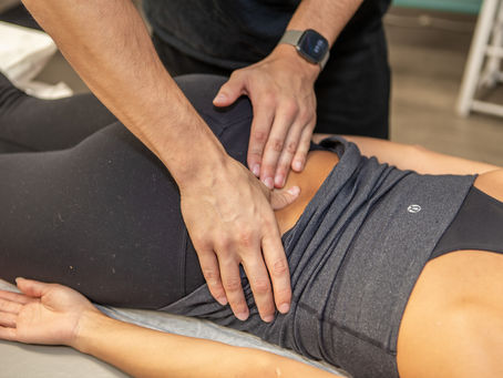 Physiotherapist examining a patient with lumbar spinal stenosis at Pursuit Physiotherapy Burlington