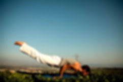 A man balancing on his hands.