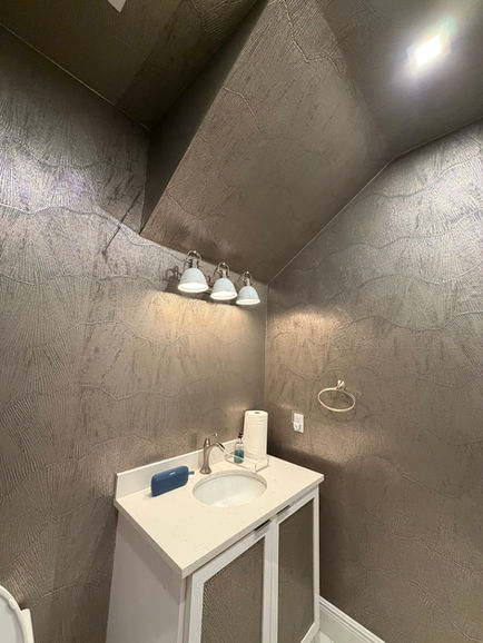 Phillip Jeffries metallic vinyl wallpaper floor-to-ceiling powder room installation in Jupiter FL