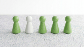 a row of pawns, all green with one white