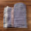 Thumbnail: Folded Violet White Handspun Handwoven Khadi Bath Towel and showing border