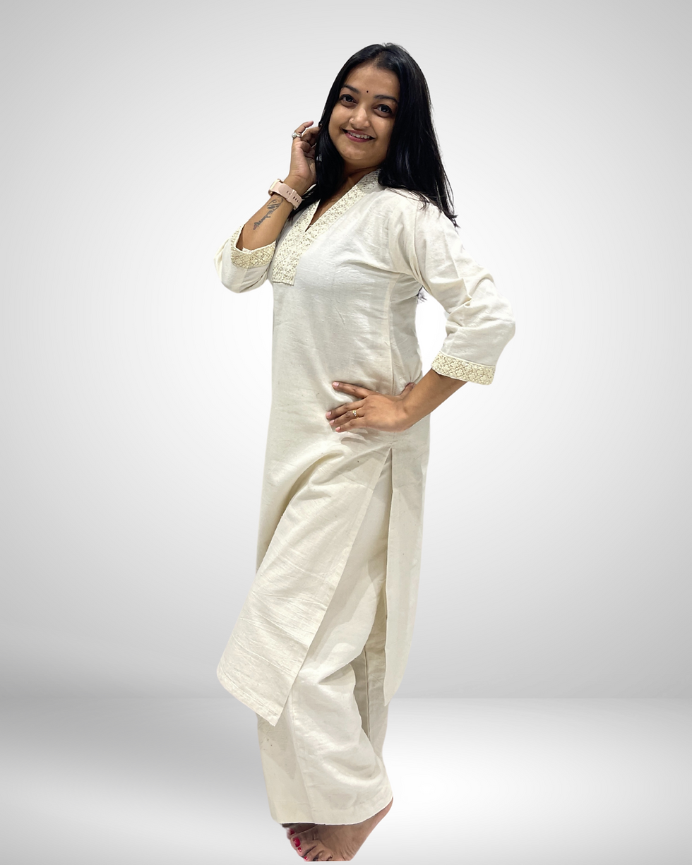Thumbnail: Side pose showing off white khadi kurti with minimal lace work and natural cotton texture