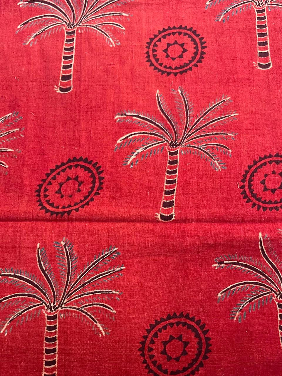 Thumbnail: Detailed close-up of black Ajrakh palm tree and motif design on red handspun Khadi cotton fabric