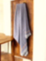 Violet White Handspun Handwoven Khadi Bath Towel Holding on wall