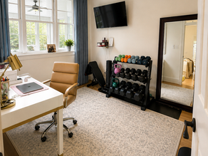 Amy Alford RN The Glucose Nurse home gym with weight rack, desk, chair, curtains, mirror 