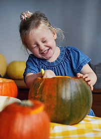 Children Scooping Out Pumpkins