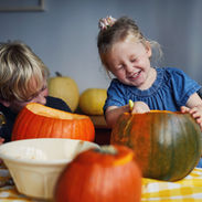 Children Scooping Out Pumpkins