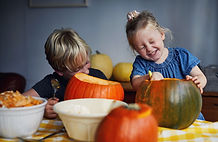 Children Scooping Out Pumpkins