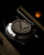 Thumbnail: Close-up of a watch caseback fitted with a beige suede adjustment cushion
