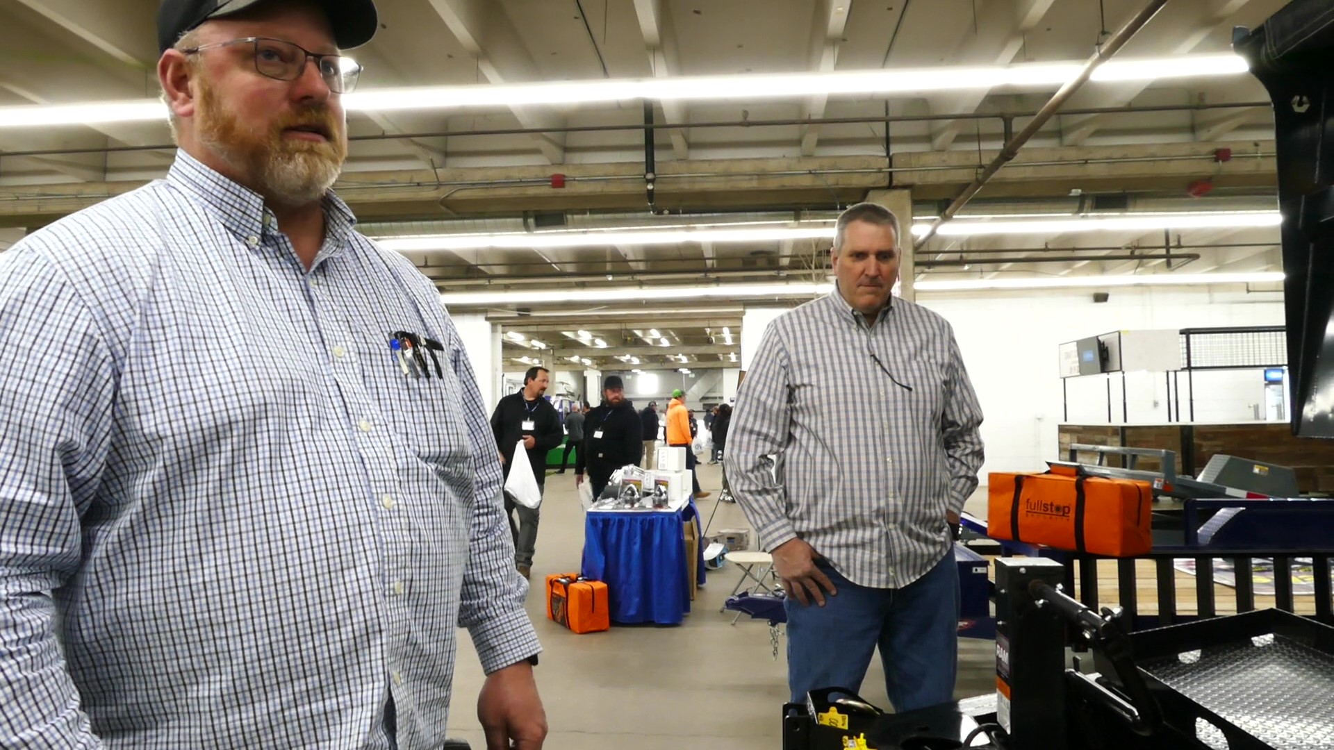 Speaking with two salesmen about their trailers at the CPS Distributors Spring Fling 2024