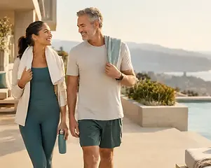 Two adults walking together after exercise