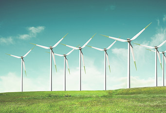Windmills on green field