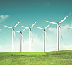Windmills on green field