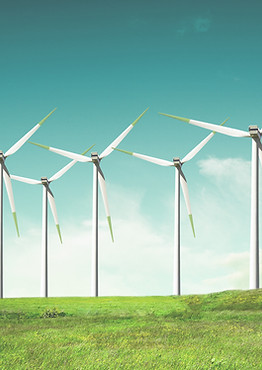 Windmills on green field