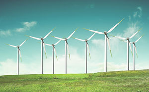 Windmills on green field