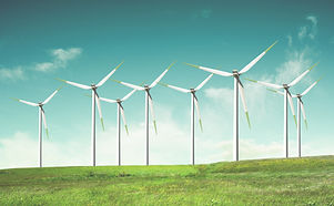 Windmills on green field