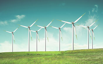 Windmills on green field