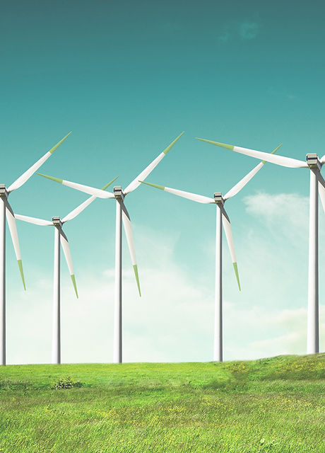 Windmills on green field