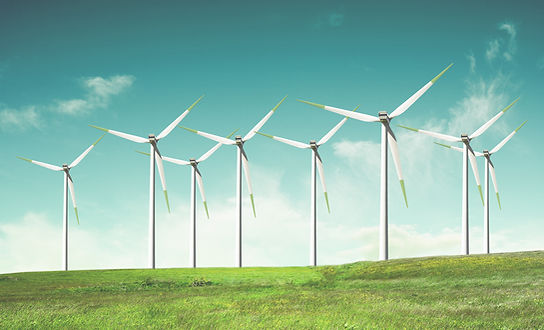 Windmills on green field