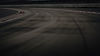 pngtree-racing-car-is-going-at-speeds-down-an-asphalt-racetrack-image_2894230_edited_edite