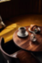 a coffee and pastry on a coffee table