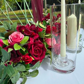 A beautiful outdoor wedding at Cliff at Lyons featuring burgundy and raspberry ceremony décor