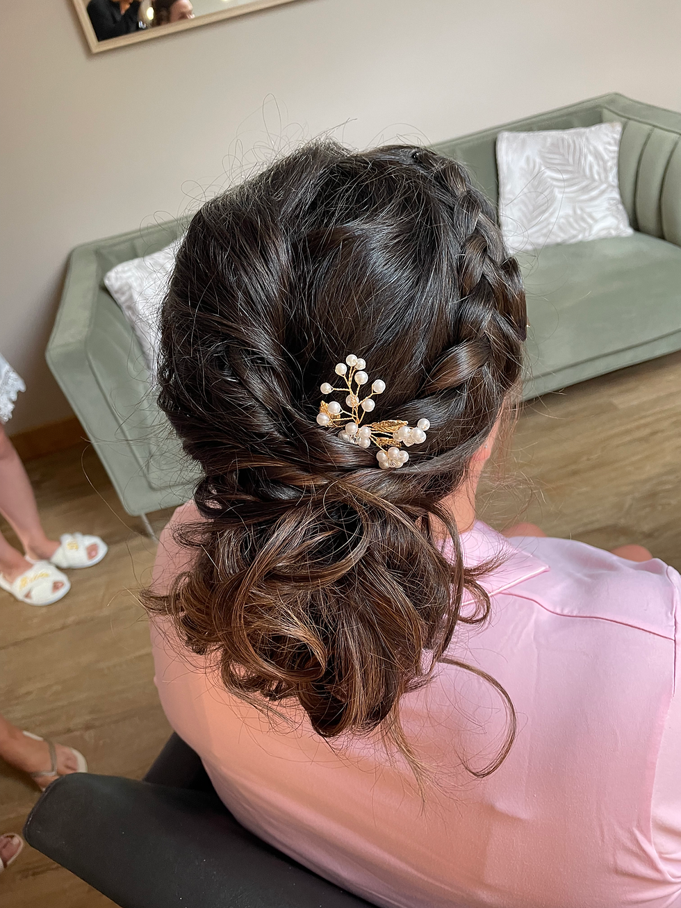 Romantic bridal hairstyle featuring a twisted up-do with soft texture and volume—ideal for vintage or historic wedding venues like Samlesbury Hall in Lancashire.