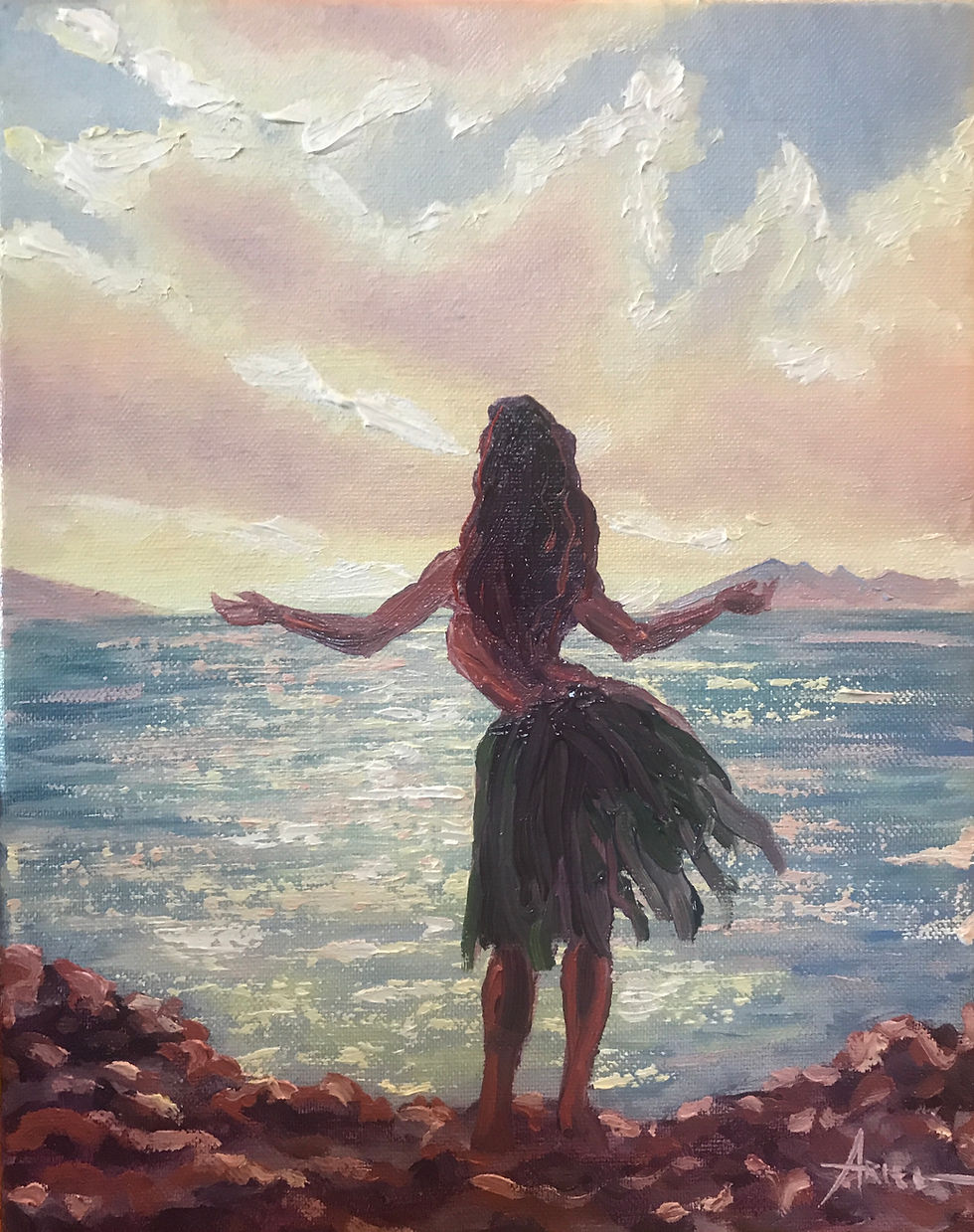 A hula dancer in a skirt stands on a rocky shore with arms open towards a sunrise over the sea. The sky is pink and yellow. Signature: Ariel.