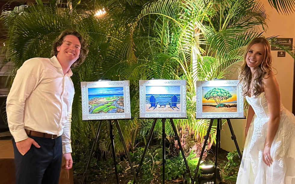 Bride and groom at Four Seasons Resort Lānaʻi posing with three custom landscape paintings created as personalized wedding keepsakes inspired by the island.
