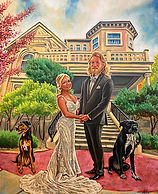 This image features a live wedding painting set in front of an elegant, stately building. The bride and groom are holding hands, radiating joy and love on their special day. Two dogs are also prominently included, adding a personal and heartwarming touch. The architectural background and lush greenery frame the couple beautifully, enhancing the sense of grandeur and intimacy.