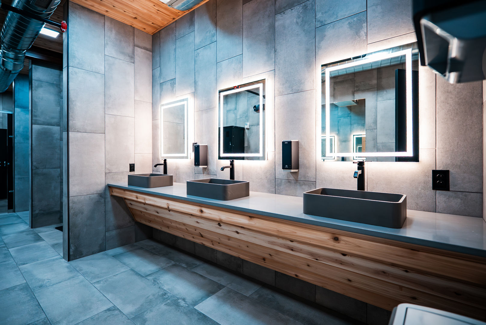 Modern locker room featuring custom wood cabinetry, premium finishes, and wellness-focused amenities.