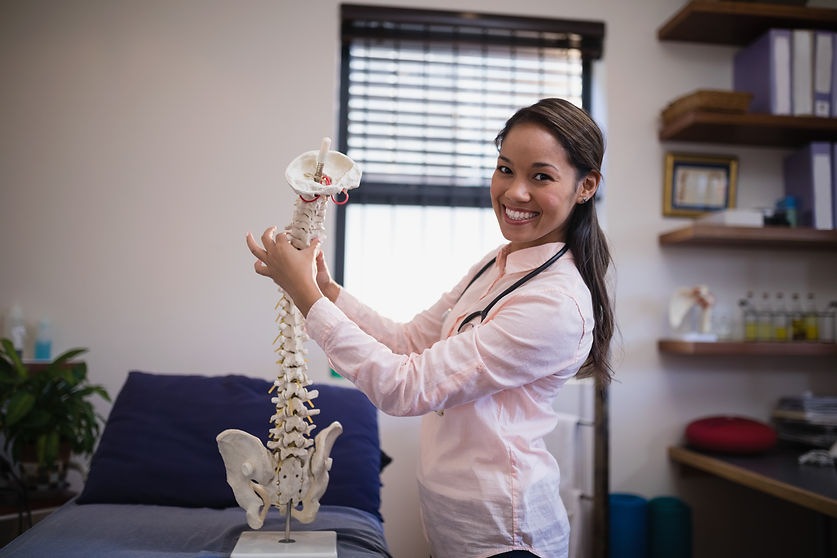portrait-of-smiling-female-therapist-examining-art-2023-11-27-04-54-12-utc.jpg