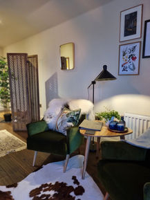 The image shows our beautiful seating area within Am Bothan Dubh, our cabin suite.