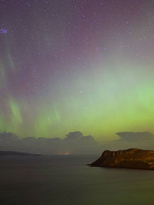 The image shows the amazing colours and shades of the night sky with Aurora Borealis.