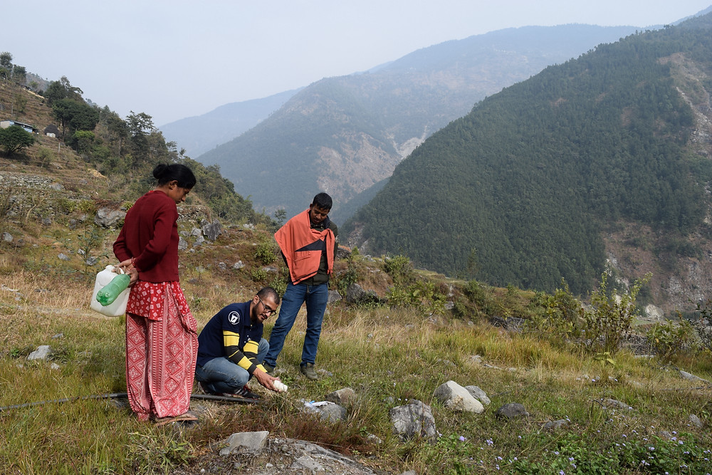 Field Ready testing a 3D printed water pipe fitting supplying a camp for earthquake survivors in Nuwakot, Nepal.