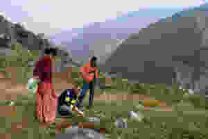 Field Ready testing a 3D printed water pipe fitting supplying a camp for earthquake survivors in Nuwakot, Nepal.