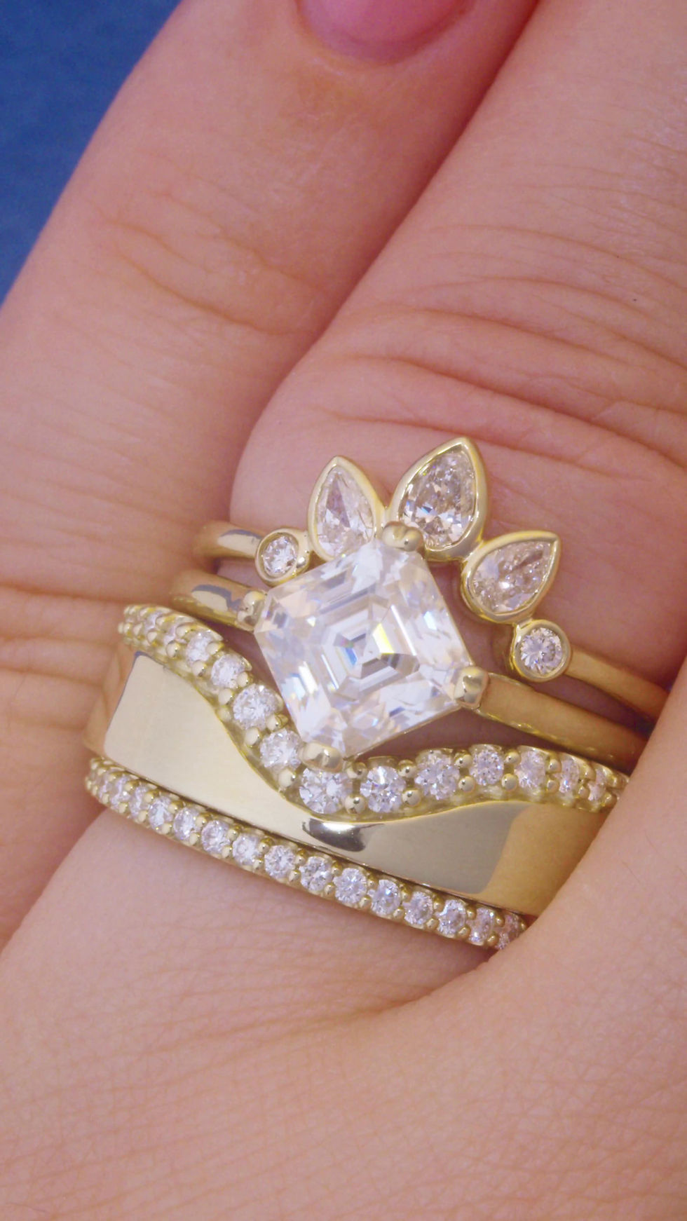 Asscher cut solitaire engagement ring made in 14k solid gold with compass style prongs.