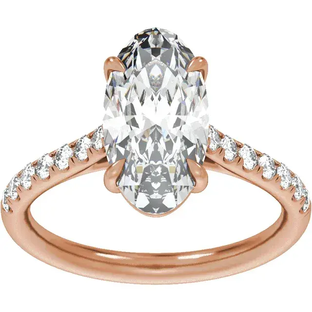 Thumbnail: A moval lab grown diamond solitaire engagement ring with a pavé diamond band.