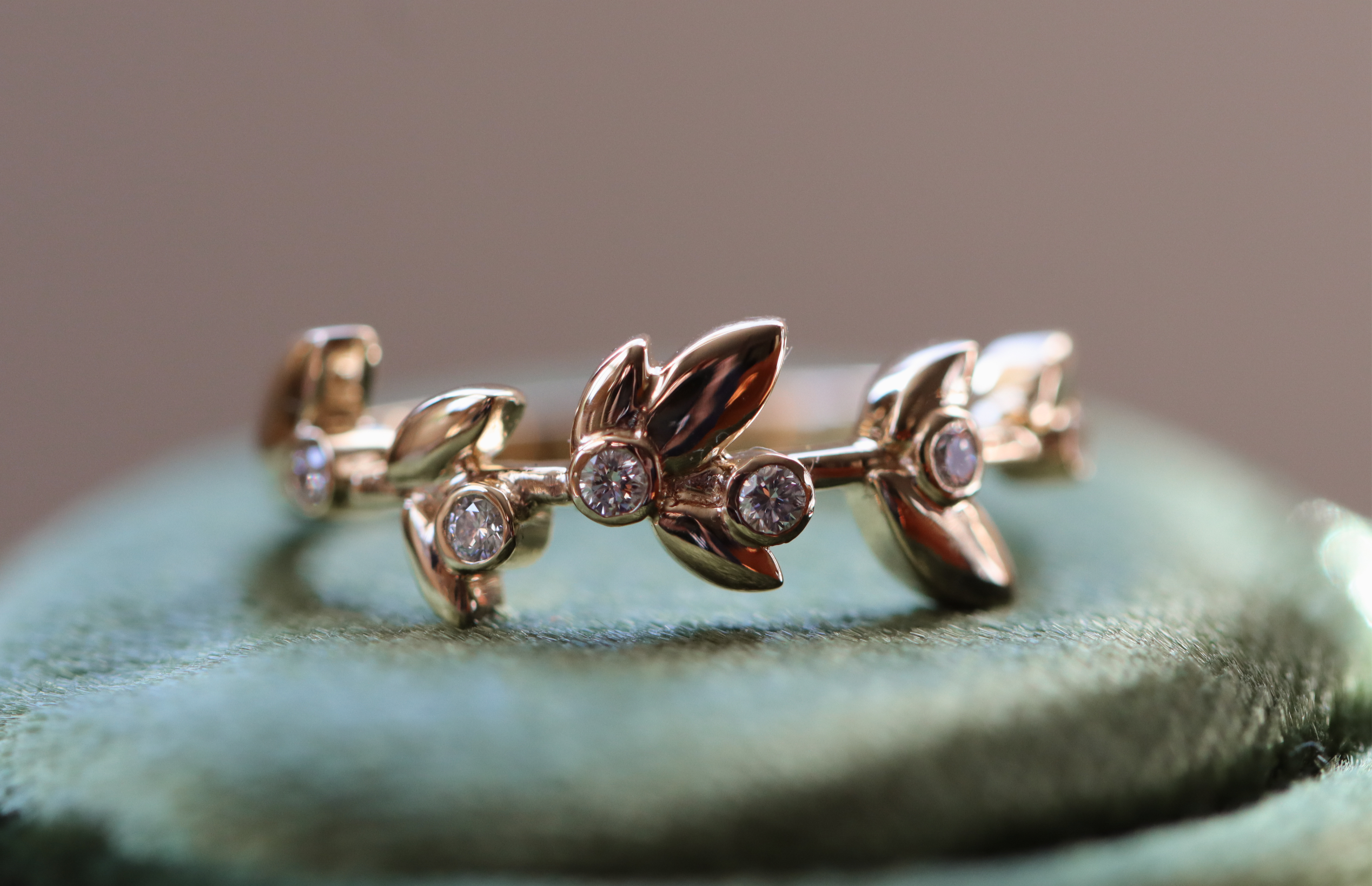 Diamond olive laurel leaf band with scattered diamonds crafted in 14k solid gold.