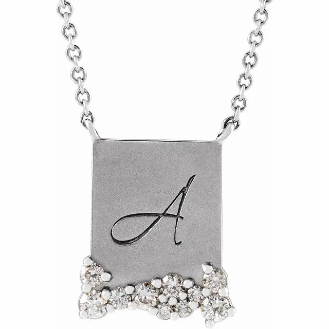 Thumbnail: scattered diamond cursive initial personalized necklace in 14k gold.