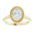 Oval bezel solitaire engagement ring with a milgrain detail, made in 14k gold.