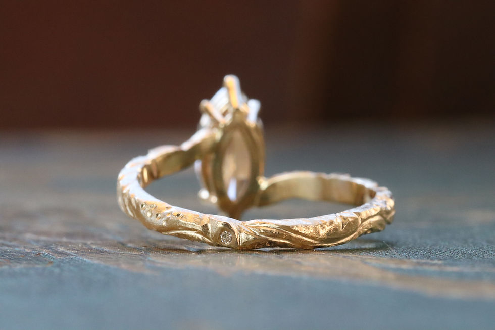 Thumbnail: Rose cut marquise lab grown diamond bypass solitaire engagement ring with hand carved details, in yellow gold.