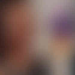 A smiling woman listening to the activity instructions