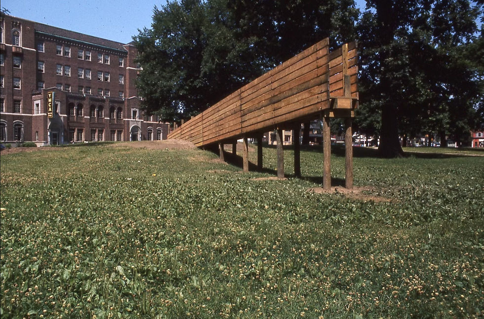 A view of Dolega's 1975 Clark Park sculpture, oriented toward the rising sun on the summer solstice, showing its elevated walkway and high railings that offered an expansive view of the park.