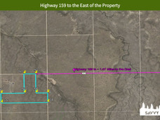 Highway 159 to the East of the Property.